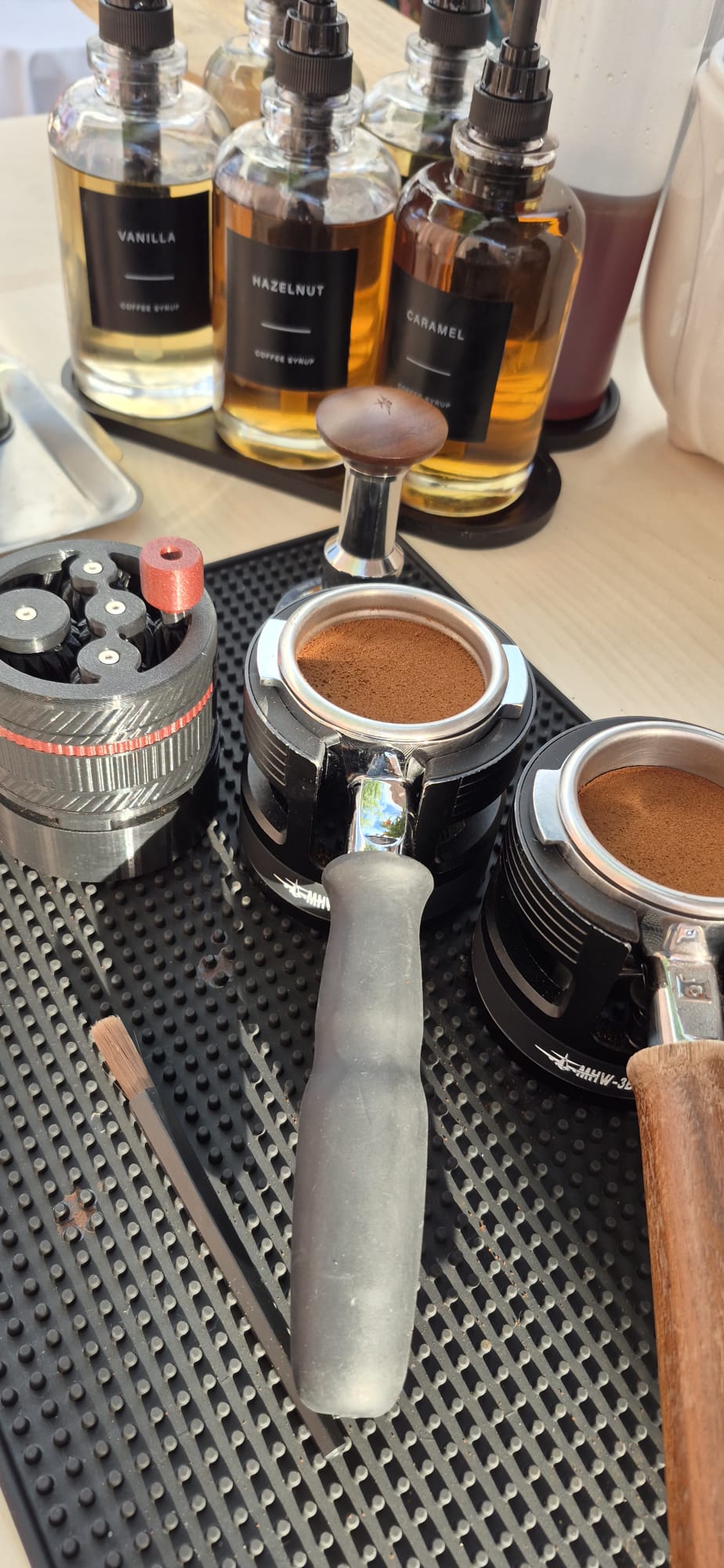 Falak Haus espresso bar setup with house-crafted syrups and portafilters